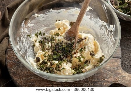Butter And Minced Young Nettles In A Bowl - Ingredients To Prepare Herbal Butter