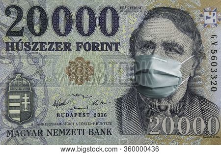 Covid-19 Coronavirus In Hungary, Forint Money Bill With Face Mask. Covid Global Stock Market. World 
