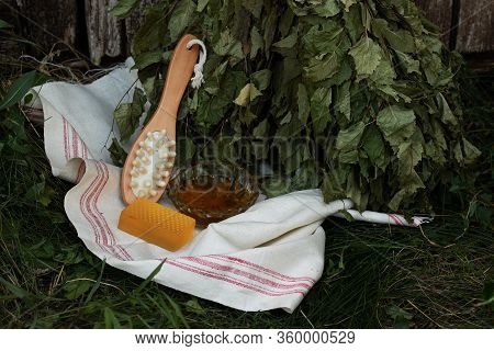 Bath Soap Lies On A Light Towel. A Birch Broom, A Body Brush And Natural Honey Lie Nearby. Set Of Ac