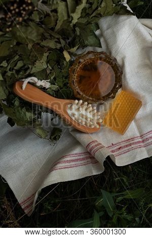 Bath Soap Lies On A Light Towel. A Birch Broom, A Body Brush And Natural Honey Lie Nearby. Set Of Ac