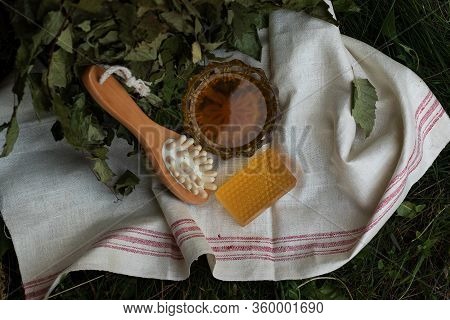 Bath Soap Lies On A Light Towel. A Birch Broom, A Body Brush And Natural Honey Lie Nearby. Set Of Ac