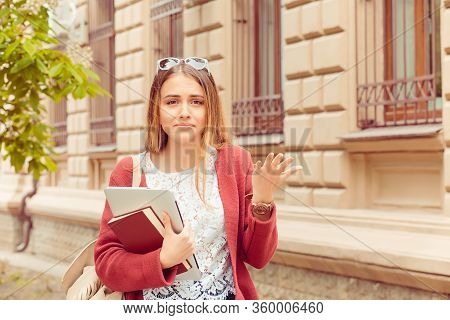 Confused Student. Closeup Portrait Puzzled Clueless Young Woman Arm Out Asking What Is Problem Who C