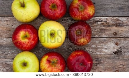Flat Lay Of Red And Yellow Apples On Vintage Wooden Background. Autumn Harvest.