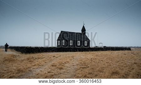 Famous Picturesque Black Church Of Budir At Snaefellsnes Peninsula Region In Iceland During A Heavy 