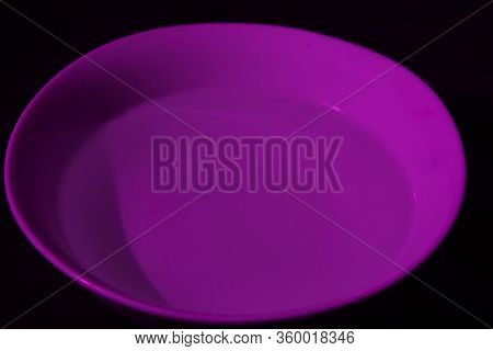White Bowl Filled With Water On Black Background