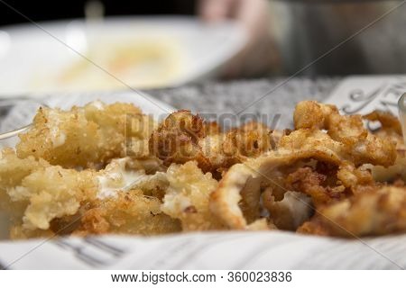Fried Breadcrumbs With Crispy Crust. Snack On Plates Close-up In A Restaurant Or Cafe.