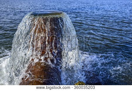 Vertical Water Flow From The Pipe To The Fish Pond