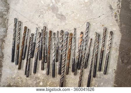 Drills On Concrete Of Different Diameter And Degree Of Novelty For A Perforator Lie On A Concrete Pl