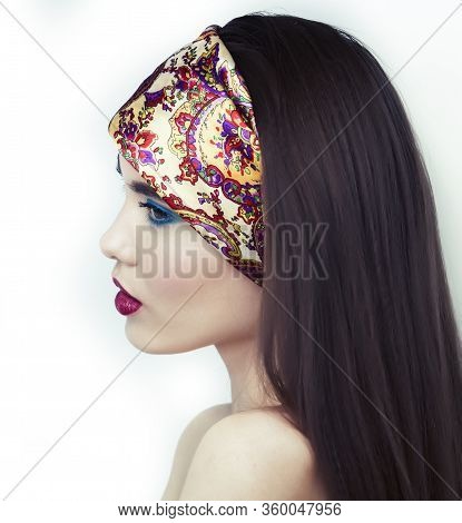 Young Pretty Modern Girl With Bright Shawl On Head Emotional Posing Isolated On White Background, As