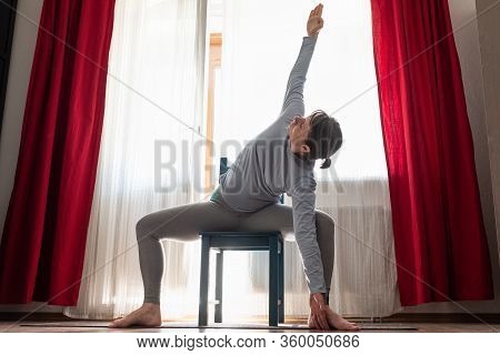 Caucasian Girl Workout Doing Twisted Goddess Pose