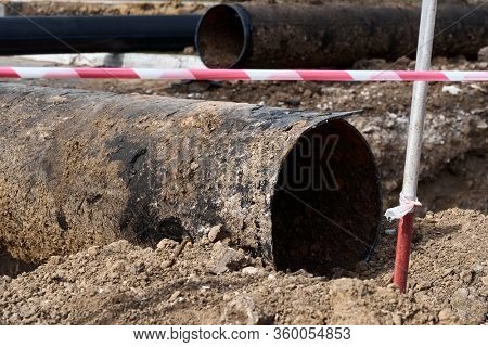 repair and replacement main pipeline of heating systems, district heating pipes network, water supply or Sewerage in city, removing old pipes and replacing them with new ones in a hole in the ground