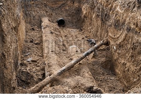repair and replacement main pipeline of heating systems, district heating pipes network, water supply or Sewerage in city, removing old pipes and replacing them with new ones in a hole in the ground