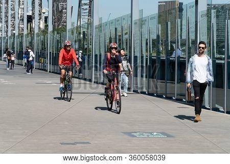 Melbourne Australia - March 10 2019; Cyclists And Walkers Crossing Sandridge Pedestrian Bridge