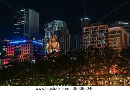 Melbourne Australia - March 9 2020; City At Night, Buildings, Lights And Corporate Brands Neon Signs