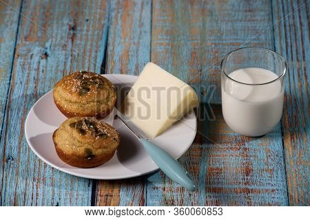 Corn Bread Made In The Form Of Muffins ( Proja ) With Sesame And Pumpkin Seeds With Cheese And Glass