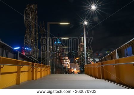 Melbourne Australia - March 14 2020; Night Scene On And Across Sandridge Pedestrian Bridge Buildings