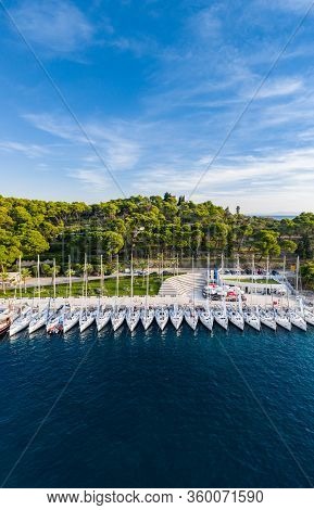 Croatia, Maslinica, 15 September 2019: Drone View Point On Moored In An Equal Row Sailboats At Sunse