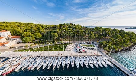Croatia, Maslinica, 15 September 2019: Drone View Point On Moored In An Equal Row Sailboats At Sunse