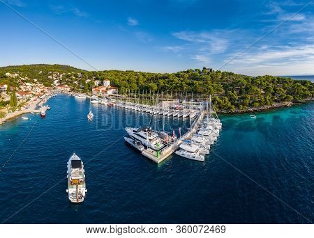 Croatia, Maslinica, 15 September 2019: Drone View Point On Moored In An Equal Row Sailboats At Sunse