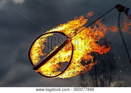 Big Metal Fireball On Fireshow, Cloudy Background.