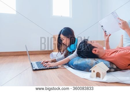 Wfh: Caucasian Asian Love Couple Work From Home During The Coronavirus Crisis. Social Distancing And