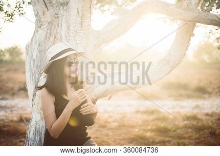 Happy Traveller Asian Woman Drinking Water From The Bottle In Spending Time At Forest,lifestyle Trav