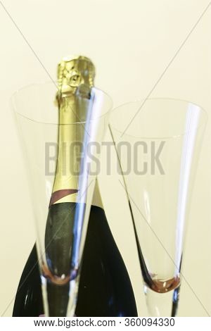 Bottle Of Shampagne And A Pair Glasses Before Drinking Isolated On The White Background