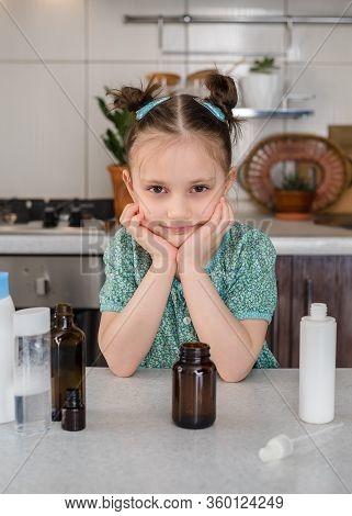 Kid Girl Makes Sanitaizer Or Antiseptic Gel At Home. Hygiene During Coronavirus Epidemic. Concept Of