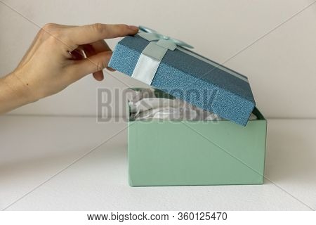 Gift Boxes With Ribbons And On A White Background.