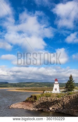 Anderson Hollow Lighthouse By The Shepody River Dam In Harvey, Bay Of Fundy, New Brunswick. Beautifu