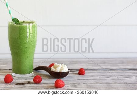 Spinach Smoothie With Full Of Fresh Kefir Grains And Raspberries For A Natural Way To Boost Immunity