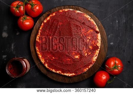 Ready-made Pizza Base With Tomato Paste And Basil