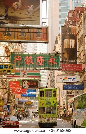 Causeway Bay, Hong Kong Island, Hong Kong, China - December 07, 2008: Traditional Tram And Store Sig
