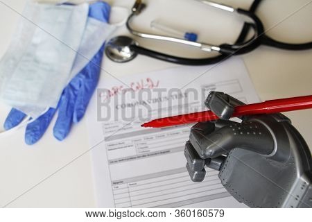 The Robot Writes Sars-sov-2. Coronavirus Test Concept. Robotic Medicine Concept. On The Table Are A 