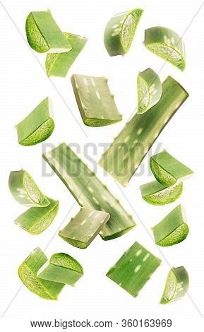 Healthy Skin Care Ingredients. Aloe Vera Slices And Leaves Flying Isolated On A White Background. Le