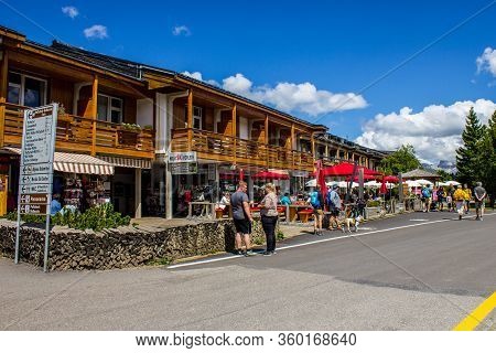 Alpe Di Siusi, Italy - August 14, 2019: People Walking In The Center Of Compaccio (compatsch).