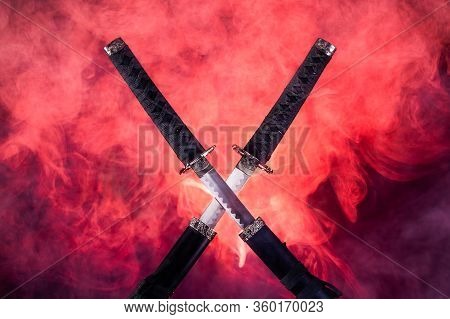 Katana, Wakizashi And Tanto On Stand, With Dramatic Blue Light