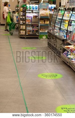 Sydney, Australia 2020-04-08 Covid-19. Stickers On The Floor At Woolworths Supermarket To Keep Socia