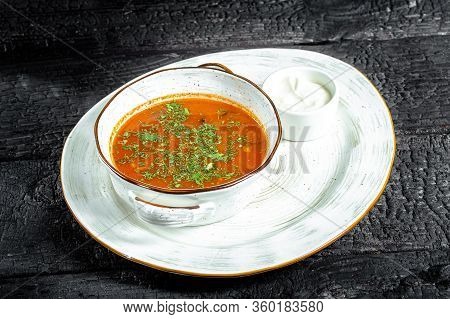 Background Black Burnt Charred Wood, Structure, Deep Blue Plate, Ukrainian Hodgepodge Soup, Borsch, 