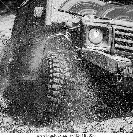 Off-road Travel On Mountain Road. Travel Concept With Big 4x4 Car. Mud And Water Splash In Off-road 