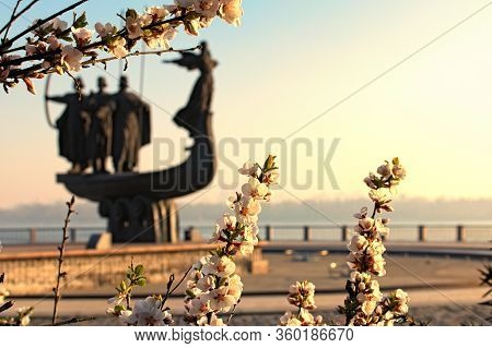 Beautiful White Blossom Flowers On Tree Branch In Sunny Spring Morning. Blurred Silhouette Of Monume