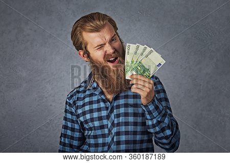 Portrait Happy Man Blinking Eye Ecstatic Celebrates Success Holding In Hand Euro Bills Banknotes Iso