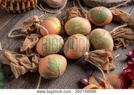 Preparation Of Easter Eggs For Dyeing With Onion Peels, With A Pattern Of Leaves
