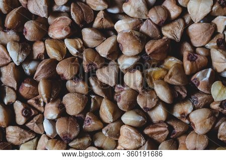 Close-up Natural Brown Raw Buckwheat Textured Background