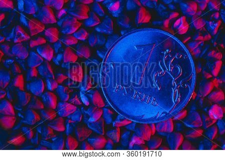One Ruble Coin In Buckwheat Under Blue Red Light