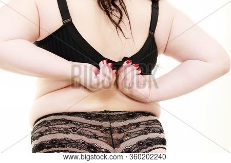 Fat Woman Wearing Black Lingerie Bra And Panties Back View. Plus Size Female Opening Taking Off Or P