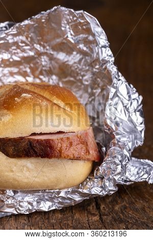 Bavarian Meat Loaf In A Bun On Wood