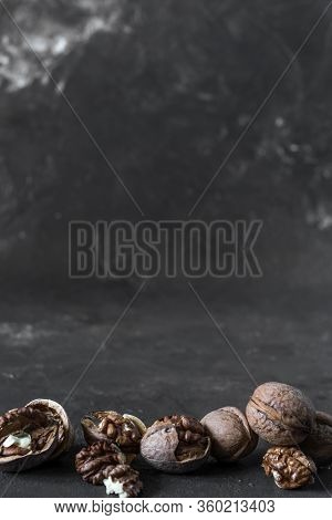 Halves Of The Kernel Of A Healthy Walnut Without Shell On A Dark Background, Walnut Macro Food Photo