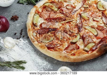 Sliced Pepperoni Pizza With Salami, Sausages And Yogurt