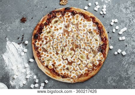 Caramelized Banana With Hazelnut Spread Pizza. Ingredients Are Pizza Dough, Sliced Banana And Hazeln